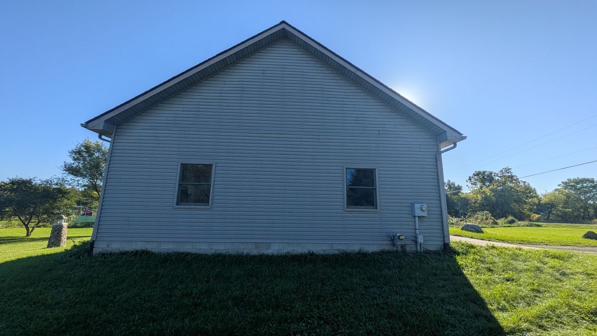 Gable end of the garage with two windows